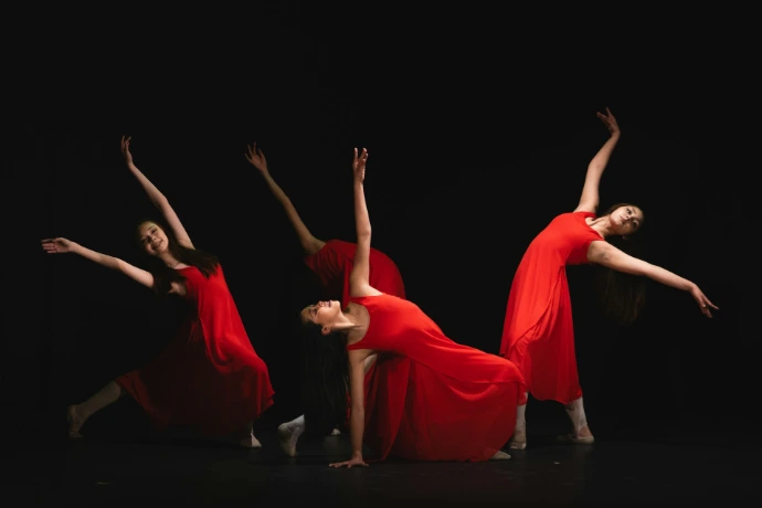Dancer in red dress performs multiple poses